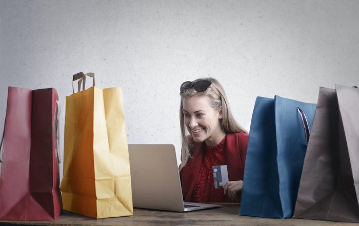 Happy woman shopping online at home