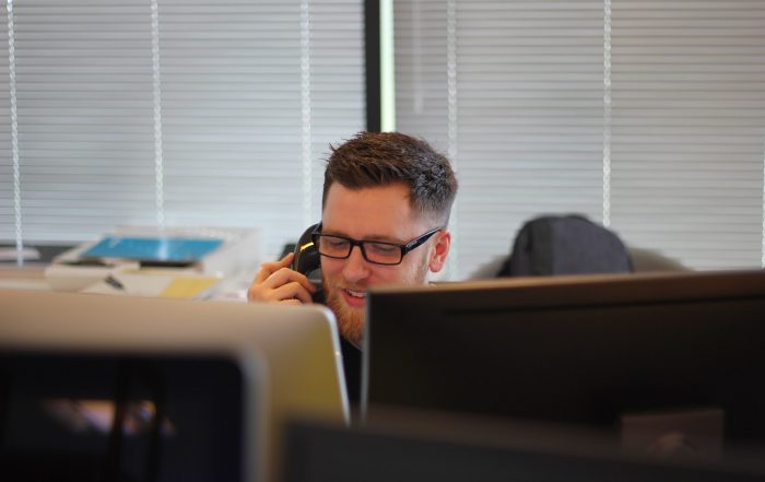 man using IP phone inside room